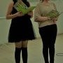 Two students from the WAS-NS school reading from the book