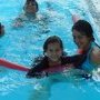 Malak (centre) with Sama (r) at the NSWAS pool